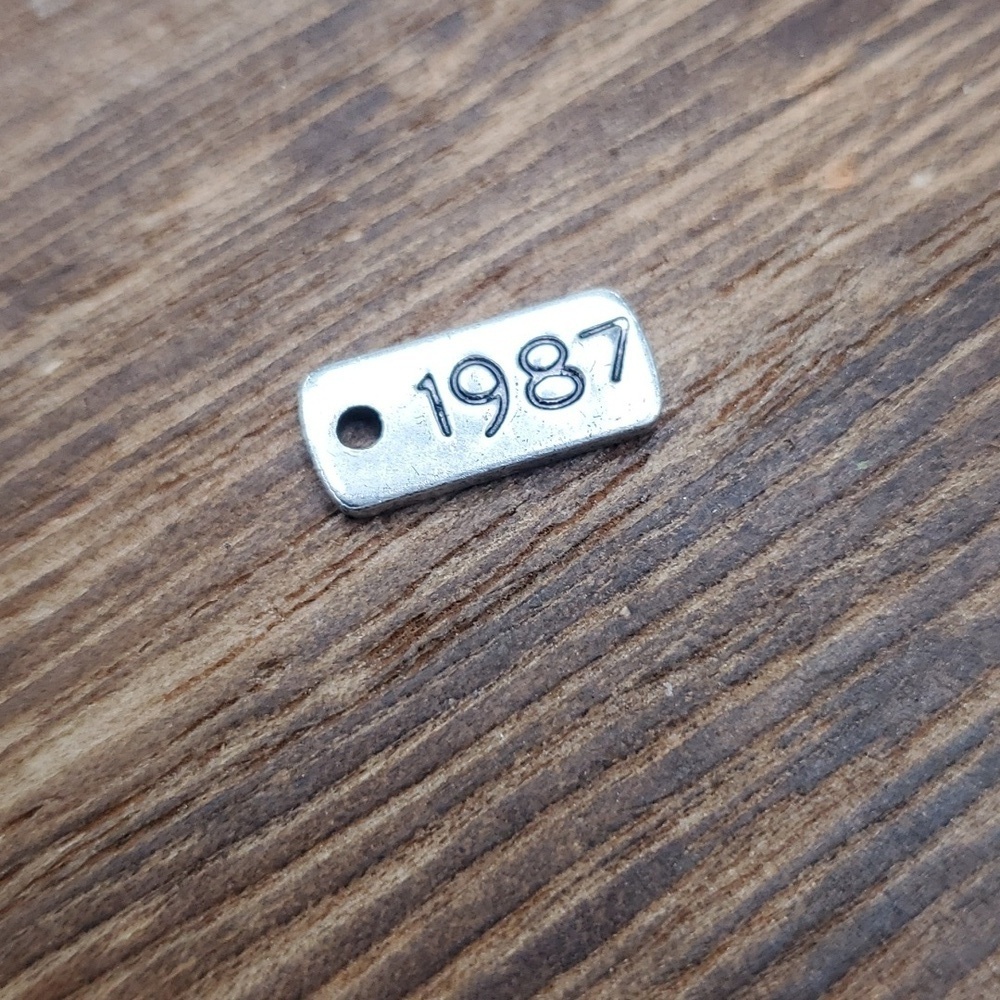 Aeropostle tag charm pendant